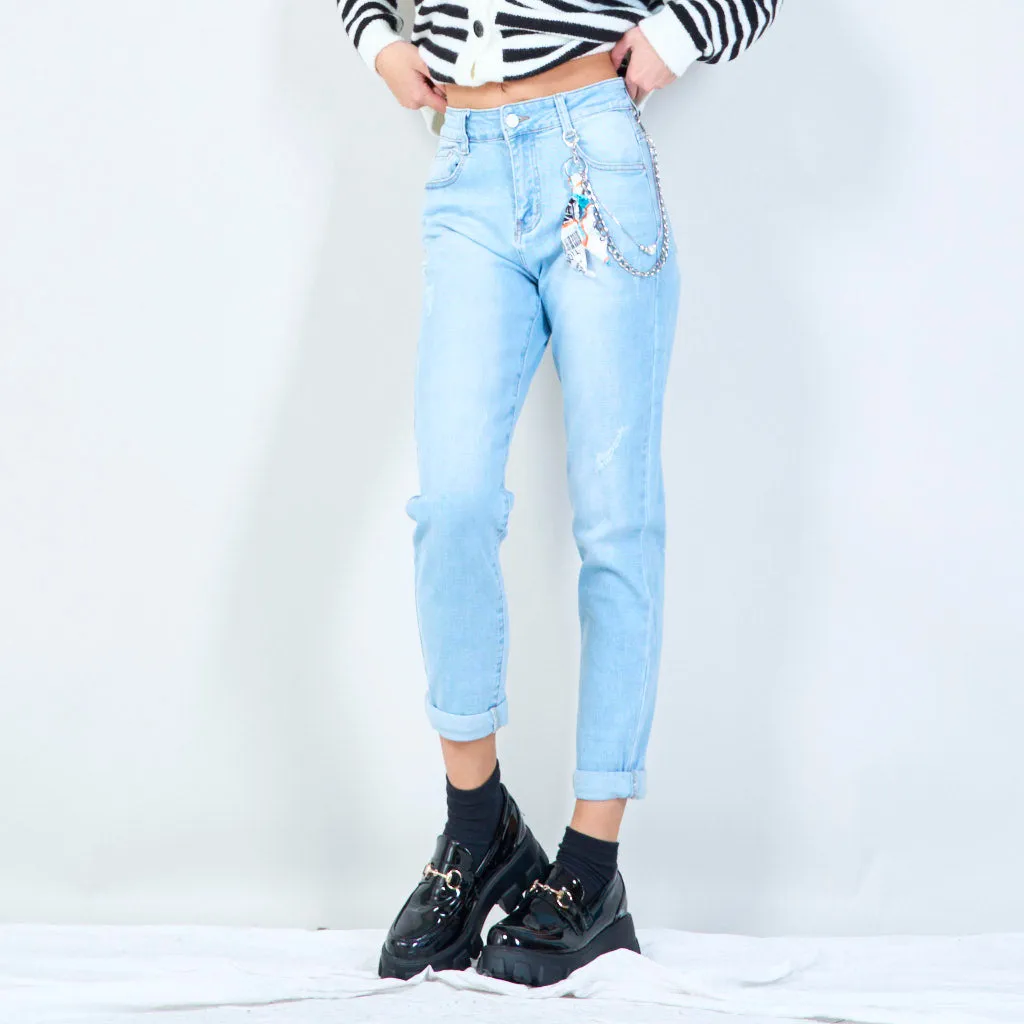 Distressed denim jeans with chain accessory wholesale