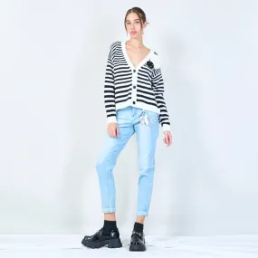 Distressed denim jeans with chain accessory wholesale