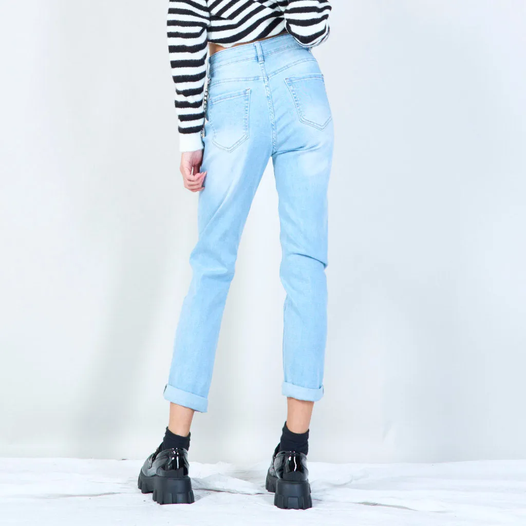 Distressed denim jeans with chain accessory wholesale